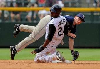 DENVER - MAY 31:  Second baseman David Eckstein #3 of the San Diego Padres collides with Dexter Fowler #24 of the Colorado Rockies as he turns a double play on a grounder by Todd Helton to shortstop Josh Wilson to end the sixth inning during MLB action at Coors Field on May 31, 2009 in Denver, Colorado. The Padres defeated the Rockies 5-2.  (Photo by Doug Pensinger/Getty Images)