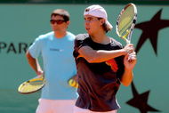 PARIS - MAY 22: ATP World Tour number one ranked player Rafael Nadal of Spain practices while his uncle and coach Toni Nadal watches from behind in preparation for the French Open at Roland Garros on May 22, 2009 in Paris, France. (Photo by Matthew Stockman/Getty Images)