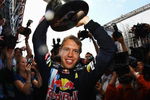 NORTHAMPTON, UNITED KINGDOM - JUNE 21:  Sebastian Vettel of Germany and Red Bull Racing celebrates with team mates in the paddock after winning the British Formula One Grand Prix at Silverstone on June 21, 2009 in Northampton, England.  (Photo by Paul Gilham/Getty Images)