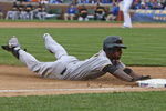 CHICAGO - MAY 27: Nyjer Morgan #3 of the Pittsburgh Pirates slides safely into third base on a 2-base error by Alfonso Soriano of the Chicago Cubs on May 27, 2009 at Wrigley Field in Chicago, Illinois. The Cubs defeated the Pirates 5-2. (Photo by Jonathan Daniel/Getty Images) 