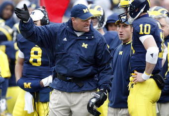 ANN ARBOR, MI - OCTOBER 25: Head coach Rich Rodriguez of the Michigan Wolverines talks with Steven Threet #10 while playing the Michigan State Spartans on October 25, 2008 at Michigan Stadium in Ann Arbor, Michigan.  (Photo by Gregory Shamus/Getty Images)