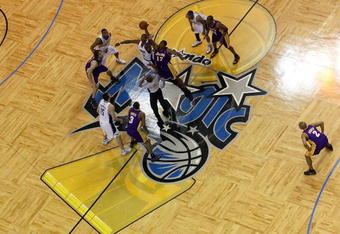 ORLANDO, FL - JUNE 14:  Andrew Bynum #17 of the Los Angeles Lakers and Dwight Howard #12 of the Orlando Magic go after the tip-off to start Game Five of the 2009 NBA Finals on June 14, 2009 at Amway Arena in Orlando, Florida.  NOTE TO USER:  User expressly acknowledges and agrees that, by downloading and or using this photograph, User is consenting to the terms and conditions of the Getty Images License Agreement.  (Photo by Ronald Martinez/Getty Images)