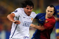 ROME - MAY 27:  Carlos Tevez of Manchester United battles for the ball with Andres Iniesta of Barcelona  during the UEFA Champions League Final match between Barcelona and Manchester United at the Stadio Olimpico on May 27, 2009 in Rome, Italy.  (Photo by Shaun Botterill/Getty Images)