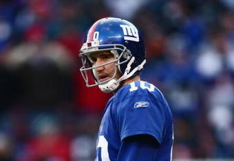 EAST RUTHERFORD, NJ -  JANUARY 11:  Eli Manning #10 of the New York Giants looks on against the Philadelphia Eagles during the NFC Divisional Playoff Game on January 11, 2009 at Giants Stadium in East Rutherford, New Jersey.  The Eagles defeated the Giants 23 -11. (Photo by Chris McGrath/Getty Images)