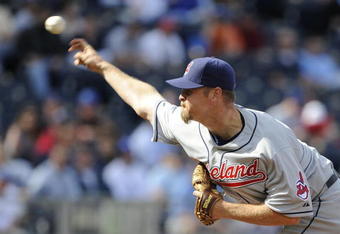 KANSAS CITY, MO - APRIL 15:  Kerry Wood of the Cleveland Indians, wearing a #42 jersey during the Jackie Robinson Day game throws a pitch in the ninth inning against the Kansas City Royals on April 15, 2009 at Kauffman Stadium in Kansas City, Missouri.  (Photo by G. Newman Lowrance/Getty Images)