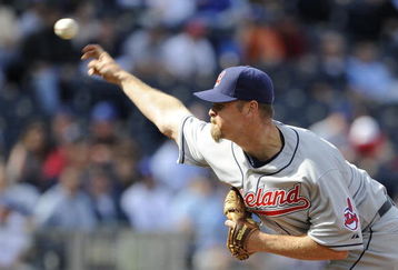 KANSAS CITY, MO - APRIL 15:  Kerry Wood of the Cleveland Indians, wearing a #42 jersey during the Jackie Robinson Day game throws a pitch in the ninth inning against the Kansas City Royals on April 15, 2009 at Kauffman Stadium in Kansas City, Missouri.  (Photo by G. Newman Lowrance/Getty Images)