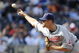 KANSAS CITY, MO - APRIL 15:  Kerry Wood of the Cleveland Indians, wearing a #42 jersey during the Jackie Robinson Day game throws a pitch in the ninth inning against the Kansas City Royals on April 15, 2009 at Kauffman Stadium in Kansas City, Missouri.  (Photo by G. Newman Lowrance/Getty Images)