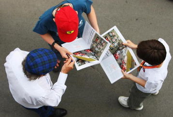 BARCELONA, SPAIN - MAY 09:  Sir Jackie Stewart signs autographs for young fans following qualifying for the Spanish Formula One Grand Prix at the Circuit de Catalunya on May 9, 2009 in Barcelona, Spain.  (Photo by Mark Thompson/Getty Images)