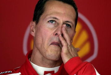 SUZUKA, JAPAN - OCTOBER 07:  Michael Schumacher of Germany and Ferrari waits in the team garage during practice for the Japan F1 Grand Prix at the Suzuka Circuit on October 7, 2005, in Suzuka, Japan.  (Photo by Paul Gilham/Getty Images)