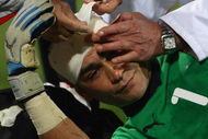 RUSTENBURG, SOUTH AFRICA - JUNE 21: Essam El Hadary of Egypt recieves medical treatment during the FIFA Confederations Cup match between Egypt and USA at Royal Bafokeng Stadium on June 21, 2009 in Rustenburg, South Africa. (Photo by Jamie McDonald/Getty Images)