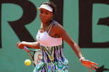 PARIS - MAY 29:  Venus Williams of USA hits a forehand during the Women's Singles Third Round match against Agnes Szavay of Hungary on day six of the French Open at Roland Garros on May 29, 2009 in Paris, France.  (Photo by Matthew Stockman/Getty Images)