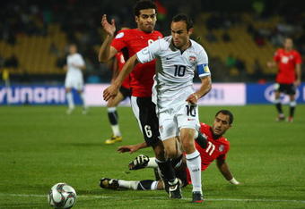 RUSTENBURG, SOUTH AFRICA - JUNE 21: Landon Donovan of USA beats the challenge of Hani Said of Egyptduring the FIFA Confederations Cup match between Egypt and USA at Royal Bafokeng Stadium on June 21, 2009 in Rustenburg, South Africa.  (Photo by Jamie McDonald/Getty Images)