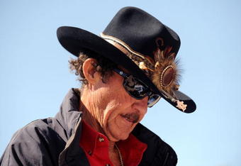 FORT WORTH, TX - APRIL 04:  Former NASCAR driver Richard Petty stands in the garage area during practice for the NASCAR Sprint Cup Series Samsung 500 at Texas Motor Speedway on April 4, 2009 in Fort Worth, Texas.  (Photo by Ronald Martinez/Getty Images for NASCAR)