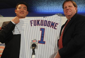 CHICAGO - DECEMBER 19:  Chicago Cubs general manager Jim Hendry (R) introduces Japanese Baseball player Kosuke Fukudome #1 (L) as their new outfielder at Wrigley Field December 19, 2007 in Chicago, Illinois.  (Photo by David Blanks/Getty Images)
