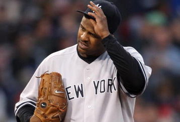 BOSTON - JUNE 11: CC Sabathia #52 of  New York Yankees reacts against the Boston Red Sox at Fenway Park on June 11, 2009 in Boston, Massachusetts.  (Photo by Jim Rogash/Getty Images)