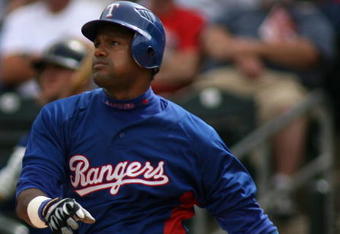 SURPRISE, AZ - MARCH 07:  Sammy Sosa #21 of the Texas Rangers hits a three run homerun against the Arizona Diamondbacks during the third inning of the MLB spring training game at Surprise Stadium on March 7, 2007 in Surprise, Arizona.  (Photo by Christian Petersen/Getty Images)
