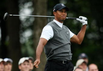 FARMINGDALE, NY - JUNE 19:  Tiger Woods watches his tee shot on the tenth hole during the continuation of the first round of the 109th U.S. Open on the Black Course at Bethpage State Park on June 19, 2009 in Farmingdale, New York.  (Photo by Nick Laham/Getty Images)