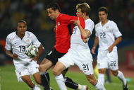RUSTENBURG, SOUTH AFRICA - JUNE 21: Ahmed Abdelghani of Egypt battles with Jonathan Spector of USA during the FIFA Confederations Cup match between Egypt and USA at Royal Bafokeng Stadium on June 21, 2009 in Rustenburg, South Africa. (Photo by Jamie McDonald/Getty Images)