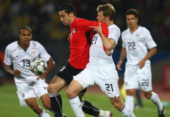 RUSTENBURG, SOUTH AFRICA - JUNE 21:  Ahmed Abdelghani of Egypt battles with Jonathan Spector of USA during the FIFA Confederations Cup match between Egypt and USA at Royal Bafokeng Stadium on June 21, 2009 in Rustenburg, South Africa.  (Photo by Jamie McDonald/Getty Images)