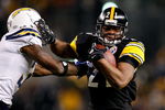 PITTSBURGH - JANUARY 11:  Mewelde Moore #21 of the Pittsburgh Steelers runs the ball against Antonio Cromartie #31 of the San Diego Chargers during their AFC Divisional Playoff Game on January 11, 2009 at Heinz Field in Pittsburgh, Pennsylvania. Steelers won 35-24.  (Photo by Gregory Shamus/Getty Images)