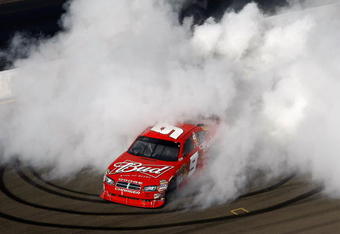 SONOMA, CA - JUNE 21: Kasey Kahne, driver of the #9 Budweiser Dodge, performs a burnout after winning the NASCAR Sprint Cup Series Toyota/Save Mart 350 at the Infineon Raceway on June 21, 2009 in Sonoma, California.  (Photo by Jonathan Ferrey/Getty Images)