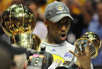 ORLANDO, FL - JUNE 14:  Kobe Bryant #24 of the Los Angeles Lakers holds the Bill Russell MVP trophy and the Larry O'Brien trophy after defeating the Orlando Magic in Game Five of the 2009 NBA Finals on June 14, 2009 at Amway Arena in Orlando, Florida. The Lakers won 99-86.  NOTE TO USER:  User expressly acknowledges and agrees that, by downloading and or using this photograph, User is consenting to the terms and conditions of the Getty Images License Agreement. (Photo by Ronald Martinez/Getty Images) 