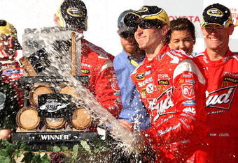 SONOMA, CA - JUNE 21:  Kasey Kahne, driver of the #9 Budweiser Dodge, celebrates in victory lane after winning the NASCAR Sprint Cup Series Toyota/Save Mart 350 at the Infineon Raceway on June 21, 2009 in Sonoma, California.  (Photo by Ezra Shaw/Getty Images for NASCAR)
