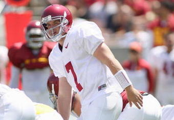 LOS ANGELES, CA - APRIL 25: Quarterback Matt Barkley #7 of the USC Trojans at the line of scrimmage during the spring game on April 25, 2009 at the Los Angeles Memorial Coliseum in Los Angeles, California.  The cardinal team won 16-10.  (Photo by Jeff Golden/Getty Images)