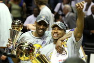 ORLANDO, FL - JUNE 14:  Kobe Bryant #24 of the Los Angeles Lakers holds the Bill Russell MVP trophy and Derek Fisher #2 of the Lakers holds the Larry O'Brien trophy after the Lakers defeated the Orlando Magic 99-86 in Game Five of the 2009 NBA Finals on June 14, 2009 at Amway Arena in Orlando, Florida.  NOTE TO USER:  User expressly acknowledges and agrees that, by downloading and or using this photograph, User is consenting to the terms and conditions of the Getty Images License Agreement.  (Photo by Elsa/Getty Images)