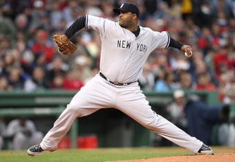 BOSTON - JUNE 11: CC Sabathia #52 of  New York Yankees throws against the Boston Red Sox at Fenway Park on June 11, 2009 in Boston, Massachusetts.  (Photo by Jim Rogash/Getty Images)