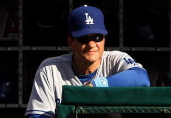 ANAHEIM, CA - JUNE 21: Manager Joe Torre of the Los Angeles Dodgers looks on from the dugout during the game with the Los Angeles Angels of Anaheim on June 21, 2009 at Angel Stadium in Anaheim, California.   (Photo by Stephen Dunn/Getty Images)