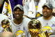 ORLANDO, FL - JUNE 14:  Kobe Bryant #24 of the Los Angeles Lakers holds the Bill Russell MVP trophy and Derek Fisher #2 of the Lakers holds the Larry O'Brien trophy after the Lakers defeated the Orlando Magic 99-86 in Game Five of the 2009 NBA Finals on June 14, 2009 at Amway Arena in Orlando, Florida.  NOTE TO USER:  User expressly acknowledges and agrees that, by downloading and or using this photograph, User is consenting to the terms and conditions of the Getty Images License Agreement.  (Photo by Elsa/Getty Images)