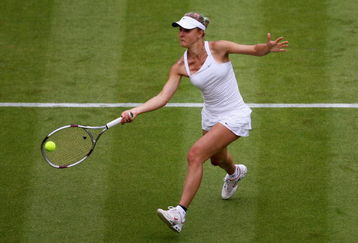 WIMBLEDON, ENGLAND - JUNE 22:  Viktoriya Kutuzova of Ukraine plays a forehand during the women's singles first round match against Maria Sharapova of Russia on Day One of the Wimbledon Lawn Tennis Championships at the All England Lawn Tennis and Croquet Club on June 22, 2009 in London, England.  (Photo by Julian Finney/Getty Images)