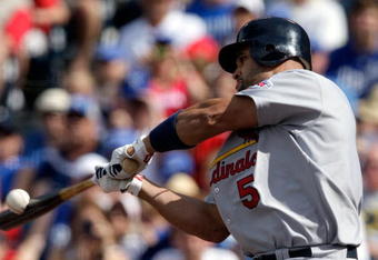 KANSAS CITY, MO - JUNE 20:  Albert Pujols #5 of the St. Louis Cardinals makes contact during the game against the Kansas City Royals on June 20, 2009 at Kauffman Stadium in Kansas City, Missouri.  (Photo by Jamie Squire/Getty Images)
