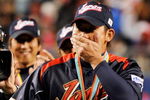 LOS ANGELES, CA - MARCH 23:  Daisuke Matsuzaka #18 of Japan reacts to being named the MVP trophy after defeating Korea during the finals of the 2009 World Baseball Classic on March 23, 2009 at Dodger Stadium in Los Angeles, California. Japan won 5-3 in 10 innings.  (Photo by Kevork Djansezian/Getty Images)