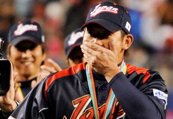 LOS ANGELES, CA - MARCH 23:  Daisuke Matsuzaka #18 of Japan reacts to being named the MVP trophy after defeating Korea during the finals of the 2009 World Baseball Classic on March 23, 2009 at Dodger Stadium in Los Angeles, California. Japan won 5-3 in 10 innings.  (Photo by Kevork Djansezian/Getty Images)