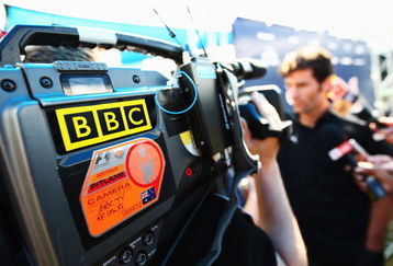 MELBOURNE, AUSTRALIA - MARCH 26:  Mark Webber of Australia and Red Bull Racing is interviewed by the BBC in the paddock during previews to the Australian Formula One Grand Prix at the Albert Park Circuit on March 26, 2009 in Melbourne, Australia.  (Photo by Clive Mason/Getty Images)