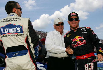 BROOKLYN, MI - JUNE 14:  Jimmie Johnson (L), driver of the #48 Lowe's Chevrolet, talks with team owner Rick Hendrick (C) and Brian Vickers (R), driver of the #83 Red Bull Toyota, before the NASCAR Sprint Cup Series LifeLock 400 at Michigan International Speedway on June 14, 2009 in Brooklyn, Michigan.  (Photo by Todd Warshaw/Getty Images for NASCAR)