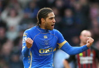 PORTSMOUTH, UNITED KINGDOM - FEBRUARY 14:  Glen Johnson of Portsmouth celebrates after scoring the opening goal during the Barclays Premier League match between Portsmouth and Manchester City at Fratton Park on February 14, 2009 in London, England.  (Photo by Phil Cole/Getty Images)