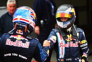 NORTHAMPTON, UNITED KINGDOM - JUNE 21:  Sebastian Vettel (R) of Germany and Red Bull Racing celebrates with second placed Mark Webber (L) of Australia and Red Bull Racing in parc ferme after winning the British Formula One Grand Prix at Silverstone on June 21, 2009 in Northampton, England.  (Photo by Clive Mason/Getty Images)