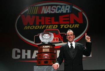 UNCASVILLE, CT - DECEMBER 13: Ted Christopher poses with the 2008 NASCAR Whelen Modified Tour Series Trophy at the Mohegan Sun Casino on December 13, 2008 in Uncasville, Connecticut.  (Photo by Chris Trotman/Getty Images)