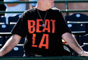 SCOTTSDALE, AZ - FEBRUARY 26:  A San Francisco Giants fan Dan Cohn (L) wearing a 'Beat LA' t-shirt waits for the start of a spring taining game against Los Angeles Dodgers at Scottsdale Stadium on February 26, 2009 in Scottsdale, Arizona.  (Photo by Kevork Djansezian/Getty Images)