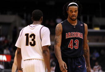 LOS ANGELES, CA - MARCH 12:  Forward Jordan Hill #43 of the Arizona Wildcats walks past guard James Harden #13 of the Arizona State Sun Devils during the final moments of their 68-56 loss to the Sun Devils during the Pacific Life Pac-10 Men's Basketball Tournament at the Staples Center on March 12, 2009 in Los Angeles, California.  (Photo by Harry How/Getty Images)
