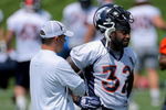 ENGLEWOOD, CO - JUNE 12:  Head coach Josh McDaniels of the Denver Broncos talks with LaMont Jordan #32 during minicamp practice at the Broncos Dove Valley training facility on June 12, 2009 in Englewood, Colorado.  (Photo by Doug Pensinger/Getty Images)