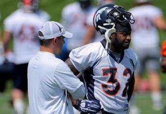 ENGLEWOOD, CO - JUNE 12:  Head coach Josh McDaniels of the Denver Broncos talks with LaMont Jordan #32 during minicamp practice at the Broncos Dove Valley training facility on June 12, 2009 in Englewood, Colorado.  (Photo by Doug Pensinger/Getty Images)