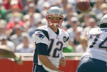 FOXBORO, MA - SEPTEMBER 7:  Quarterback Tom Brady #12 of the New England Patriots passes the ball up the middle during their NFL game against the Kansas City Chiefs on September 7, 2008 at Gillette Stadium in Foxboro, Massachusetts. The Patriots defeated the Chiefs 17-10. (Photo by Elsa Garrison/Getty Images)