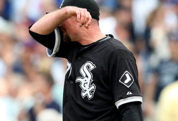 CHICAGO - JUNE 18: Scott Linebrink#71 of the Chicago White Sox reacts after giving up a three-run home run to Derrek Lee of the Chicago Cubs in the 8th inning on June 18, 2009 at Wrigley Field in Chicago, Illinois. The Cubs defeated the White Sox 6-5. (Photo by Jonathan Daniel/Getty Images)