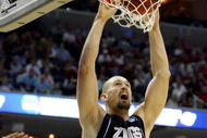 MEMPHIS, TN - MARCH 27:  Josh Heytvelt #42 of the Gonzaga Bulldogs dunks the ball over Deon Thompson #21 of the North Carolina Tar Heels in the first half during the NCAA Men's Basketball Tournament South Regionals at the FedExForum on March 27, 2009 in Memphis, Tennessee.  (Photo by Joe Murphy/Getty Images)
