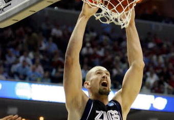 MEMPHIS, TN - MARCH 27:  Josh Heytvelt #42 of the Gonzaga Bulldogs dunks the ball over Deon Thompson #21 of the North Carolina Tar Heels in the first half during the NCAA Men's Basketball Tournament South Regionals at the FedExForum on March 27, 2009 in Memphis, Tennessee.  (Photo by Joe Murphy/Getty Images)