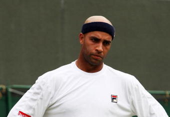 WIMBLEDON, ENGLAND - JUNE 22:  James Blake of USA reacts during the men's singles first round match against Andreas Seppi of Italy on Day One of the Wimbledon Lawn Tennis Championships at the All England Lawn Tennis and Croquet Club on June 22, 2009 in London, England.  (Photo by Hamish Blair/Getty Images)